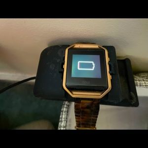 A Fitbit Blaze comes with charger and two extra bands
